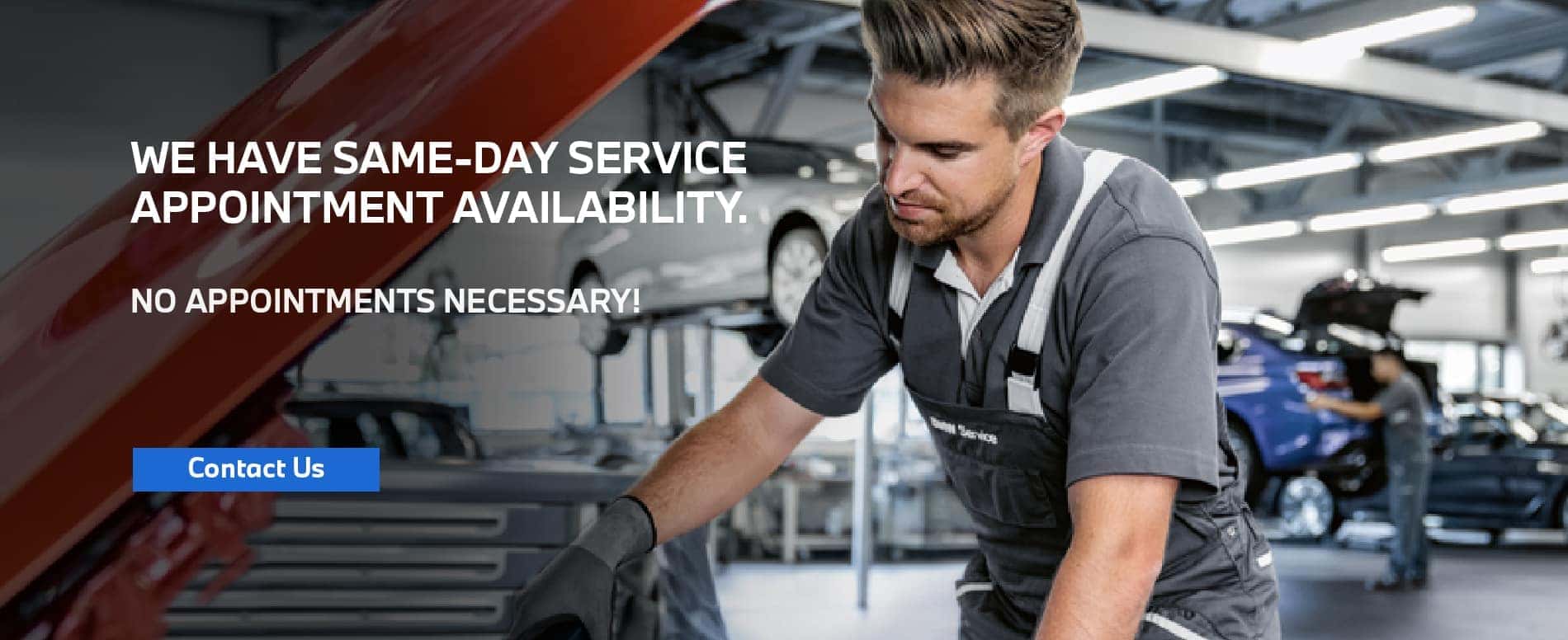 We have same-day service appointment availability. No appointment necessary. Click to contact us. Image shows a BMW service specialist working on a vehicle.
