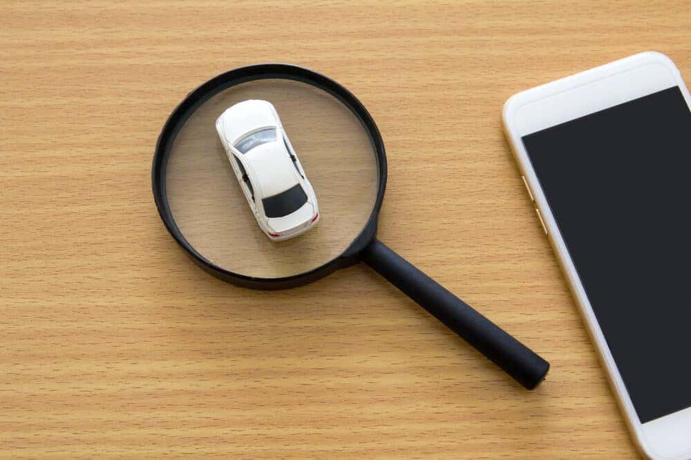 Cell phone on a table with a magnifying glass