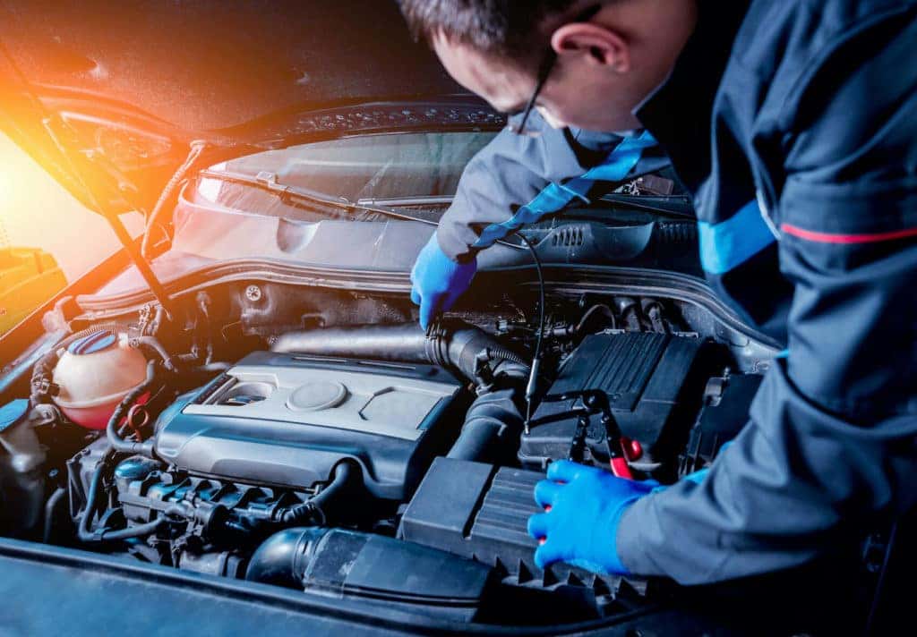 BMW Technician servicing a car