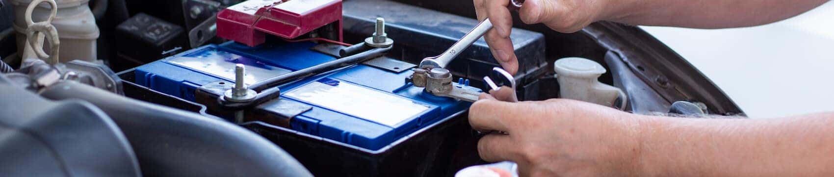 Mechanic installing a car battery