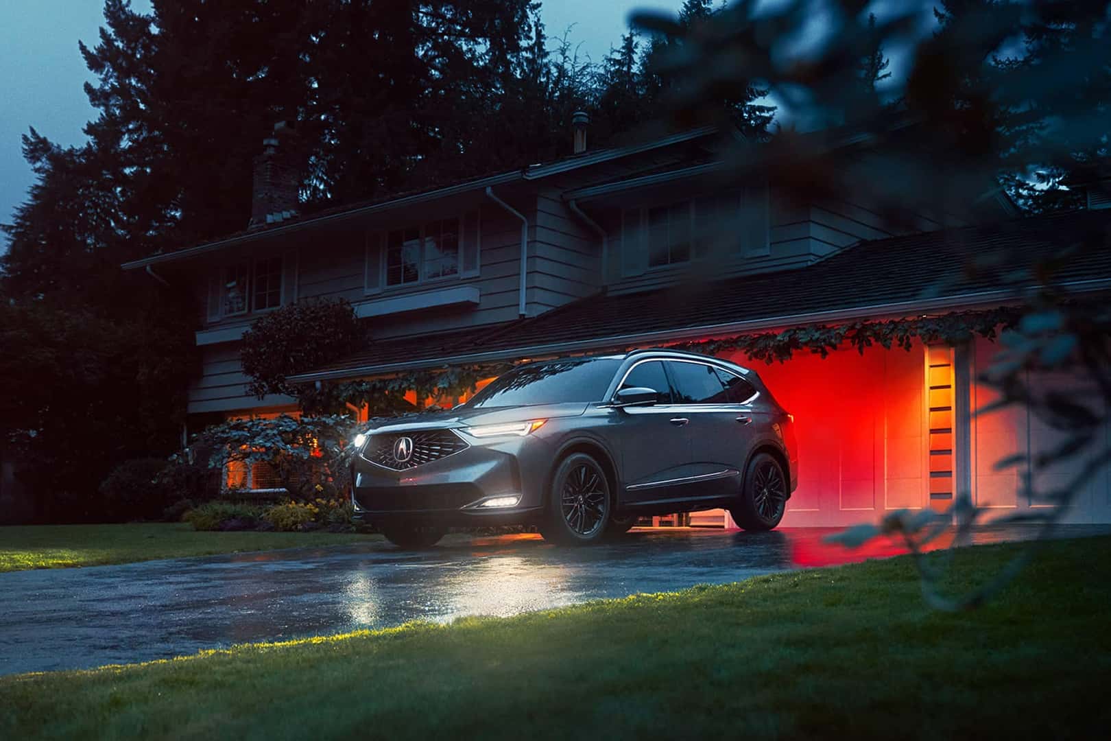 2026 acura mdx parked in front of garage