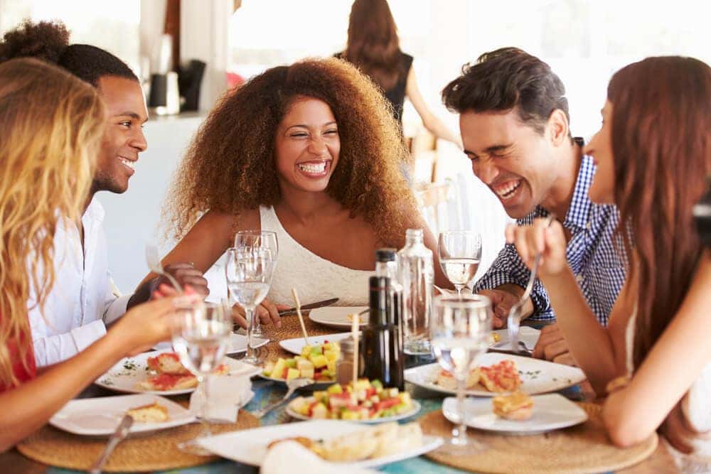Friends Enjoying Food at Restaurant