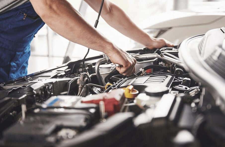 Mechanic Working on Engine